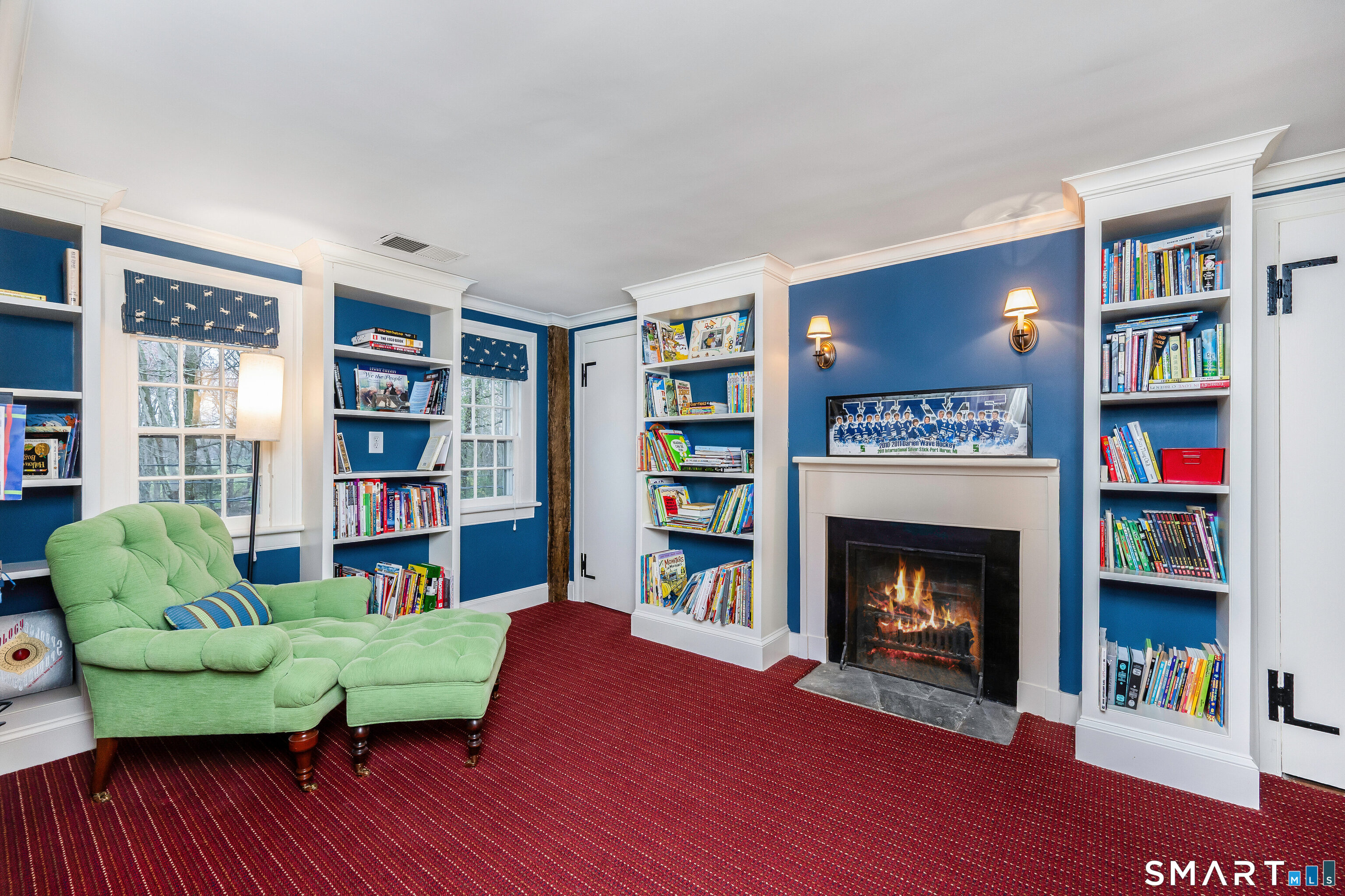 246 Brookside Road Darien, CT 06820 - Photo 23 of 40 a living room with furniture and a fireplace