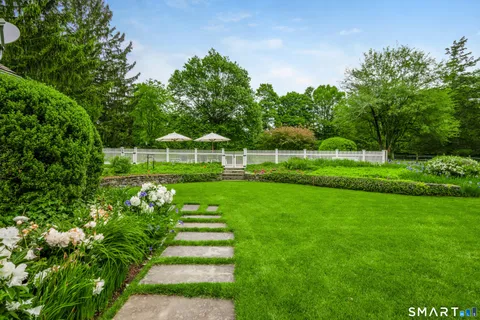 a view of a park with plants and trees