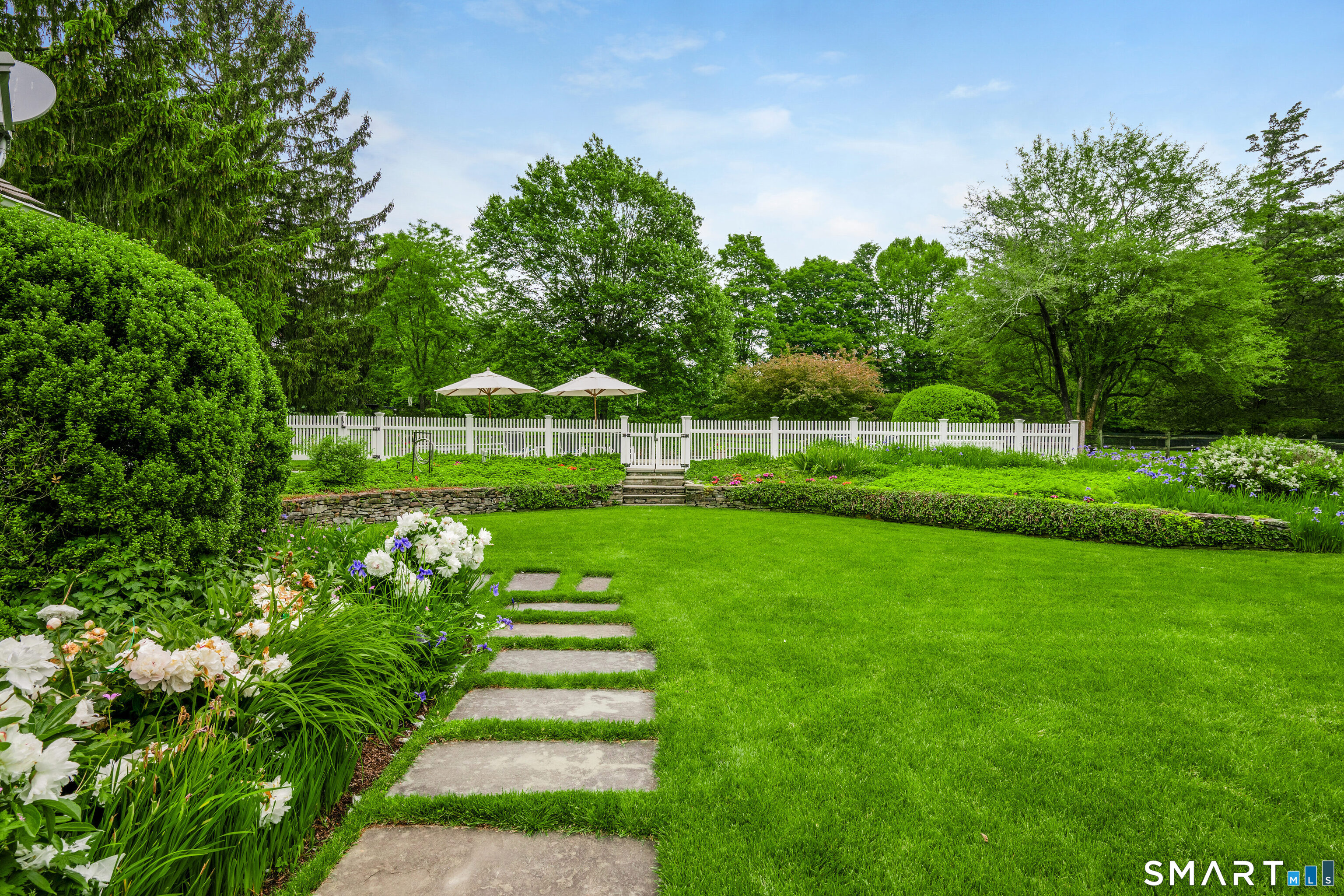 246 Brookside Road Darien, CT 06820 - Photo 28 of 40 a view of a park with plants and trees