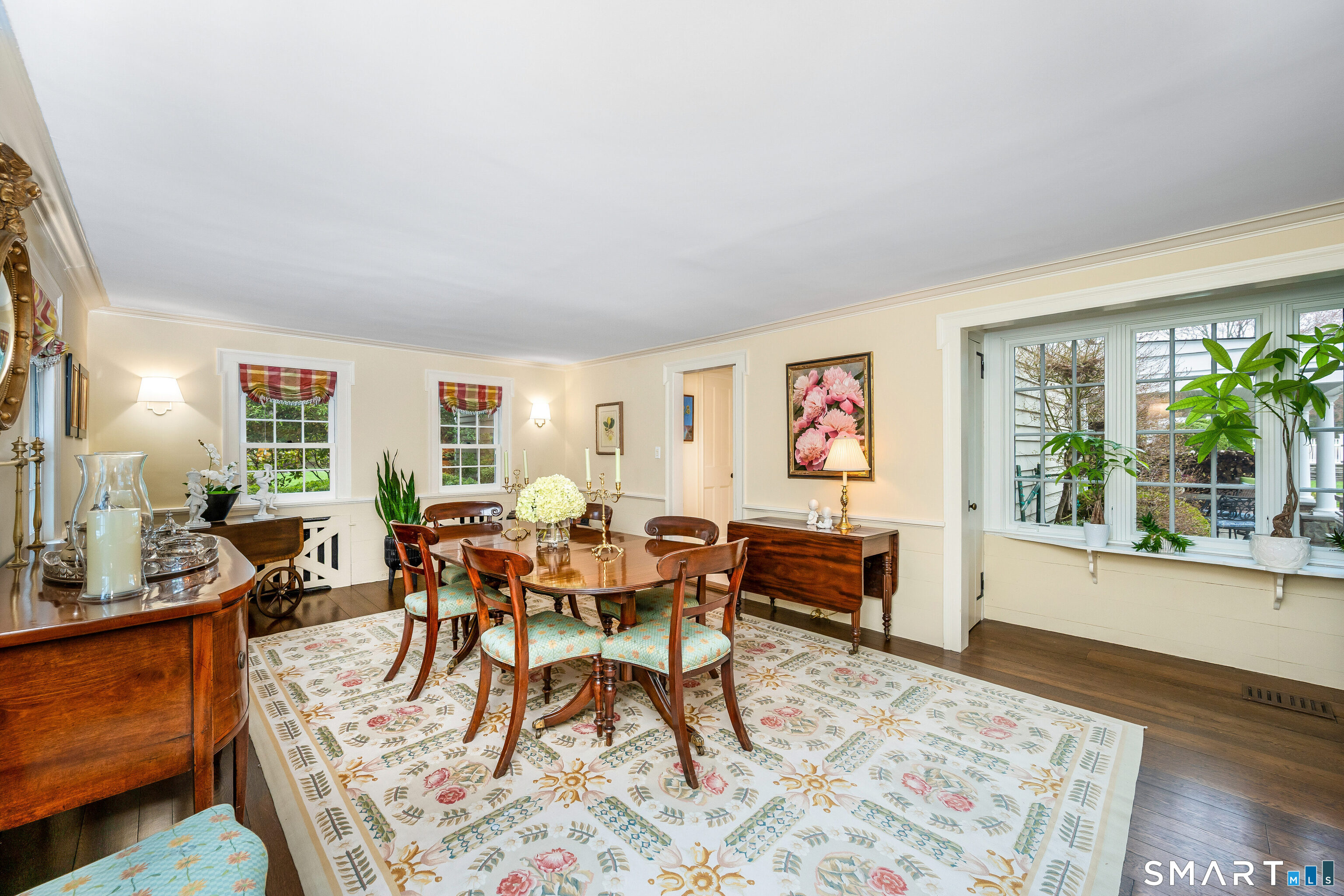 246 Brookside Road Darien, CT 06820 - Photo 7 of 40 a dining room with furniture a rug and a large window