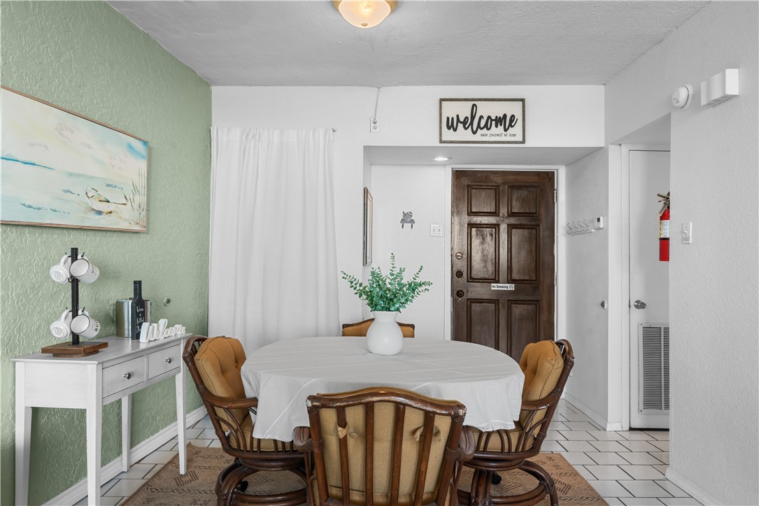14401 Commodores Drive, Unit 101 Corpus Christi, TX 78418 - Photo 11 of 26 a view of a dining room with furniture