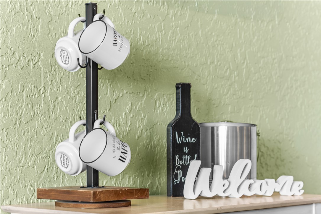 14401 Commodores Drive, Unit 101 Corpus Christi, TX 78418 - Photo 23 of 26 a close view of a light fixtures and wooden floor