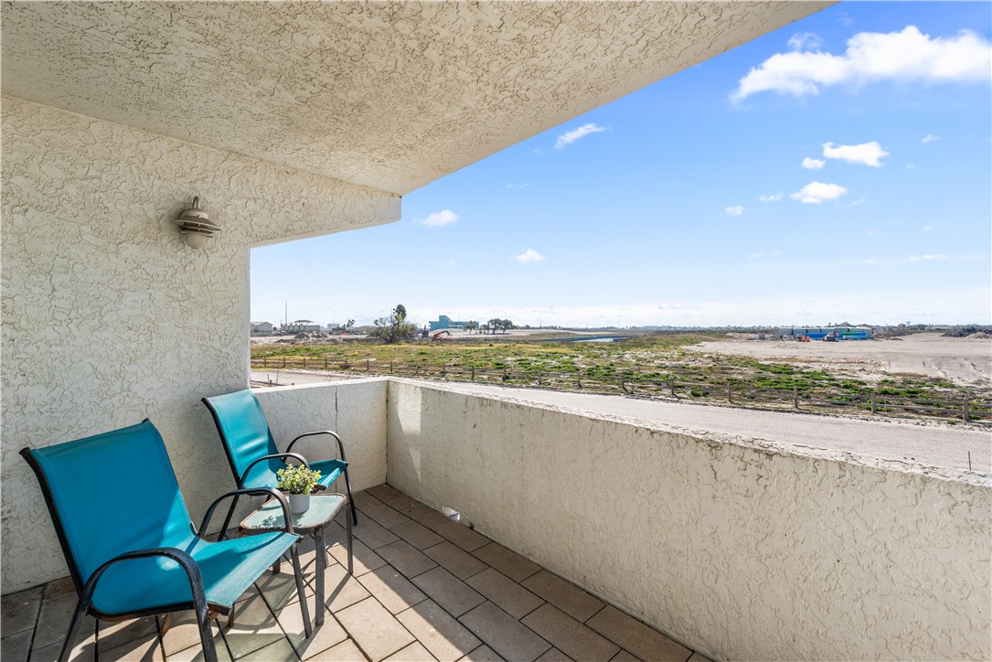 14401 Commodores Drive, Unit 101 Corpus Christi, TX 78418 - Photo 24 of 26 a view of swimming pool with outdoor seating and city view