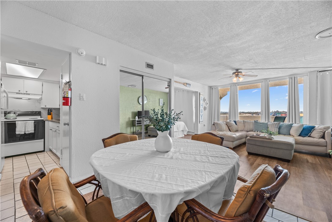 14401 Commodores Drive, Unit 101 Corpus Christi, TX 78418 - Photo 10 of 26 a view of a dining room with furniture window and wooden floor