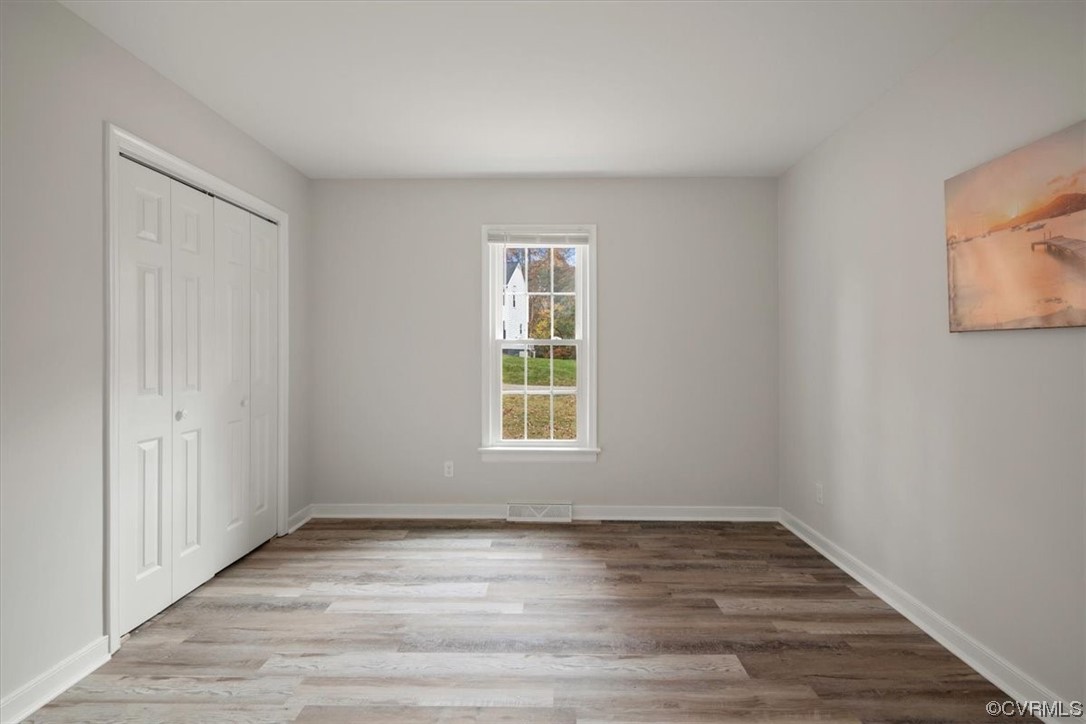 4754 Brookridge Road Chesterfield, VA 23832 - Photo 34 of 48 a view of an empty room with wooden floor and a window