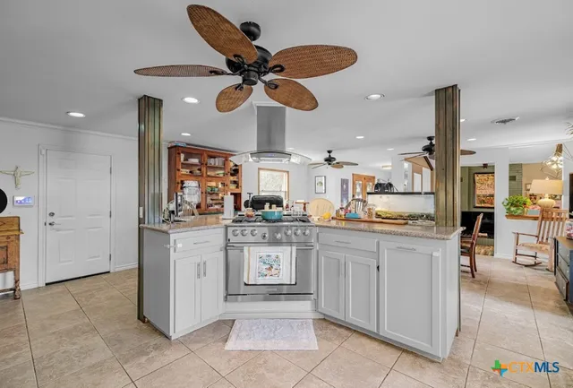 a kitchen with stainless steel appliances granite countertop a sink and cabinets