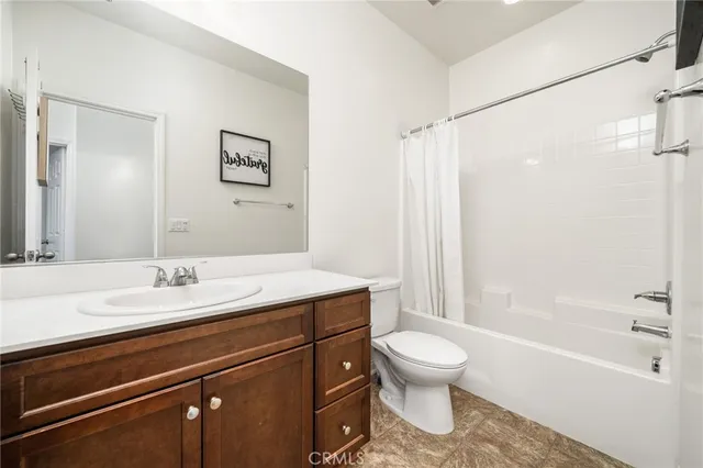 a bathroom with a sink a toilet and a bathtub