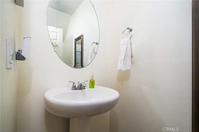 a bathroom with a sink and mirror