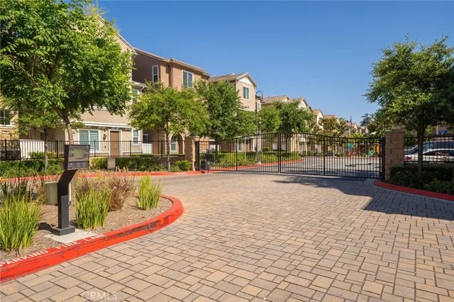 a view of a building with cars park