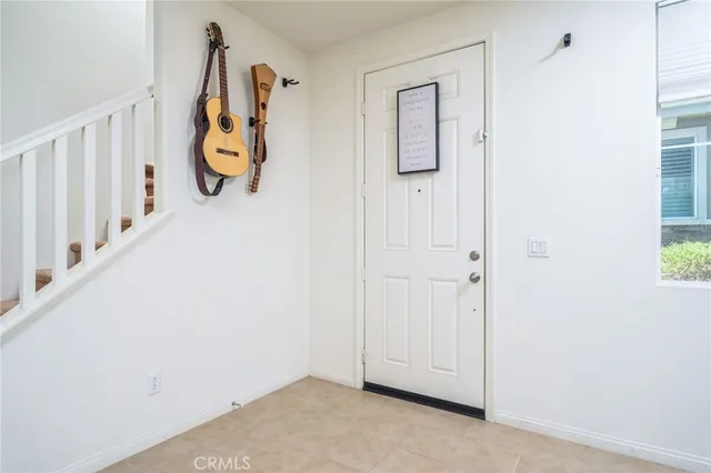 an entryway with wooden floor