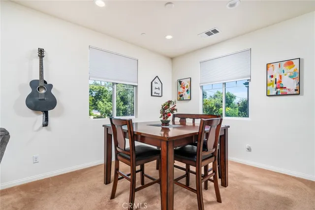 a view of a dining room with furniture window and outside view