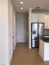 a kitchen with stainless steel appliances a refrigerator and a sink