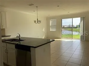 a kitchen with stainless steel appliances granite countertop a sink and a granite counter tops