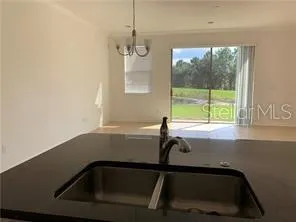 a bathroom with a bathtub and a window