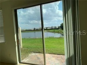 a view of a lake with houses in the background