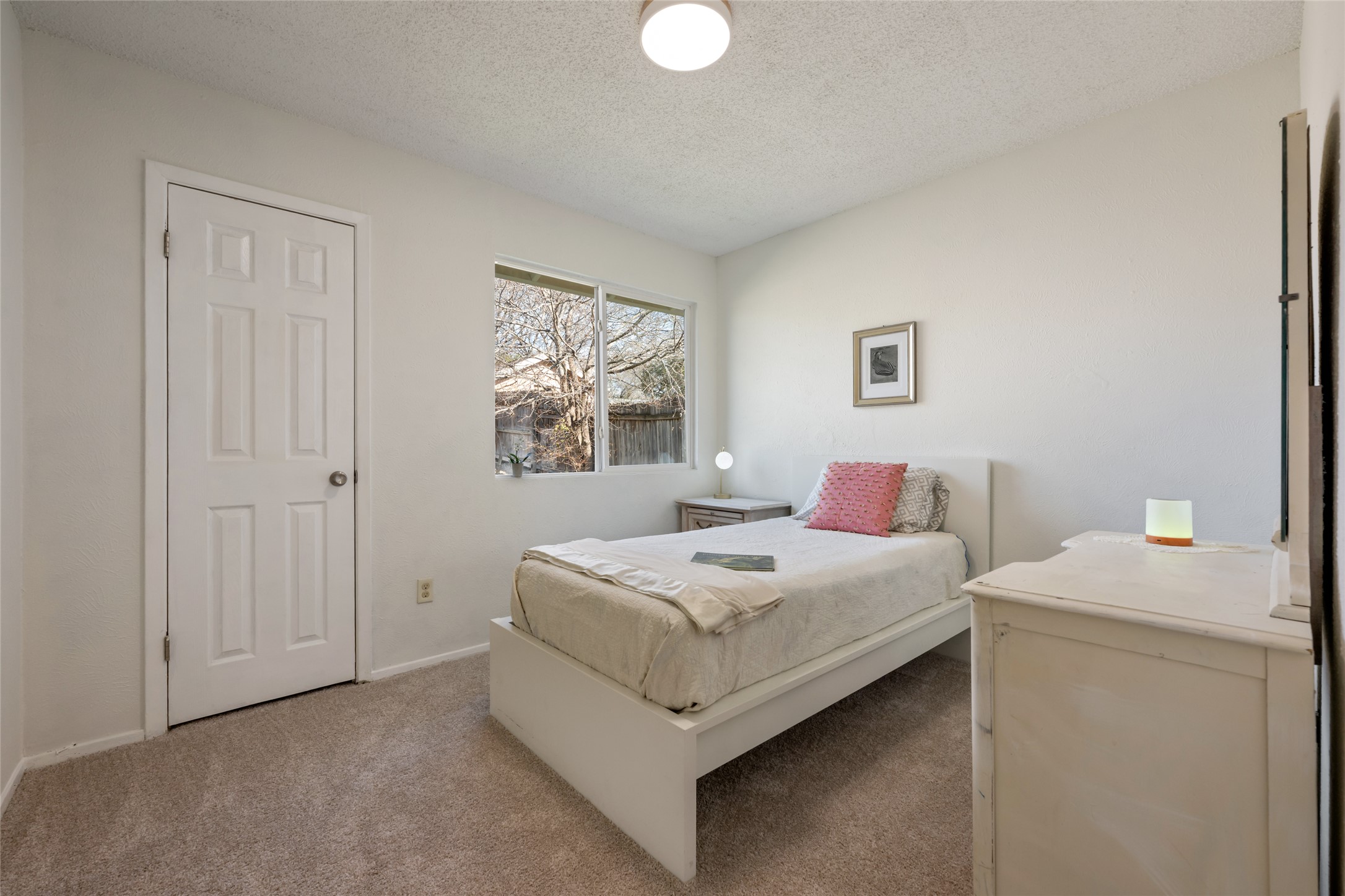5100 Lambs Lane Austin, TX 78744 - Photo 19 of 31 Secondary bedroom downstairs, with fresh carpet.