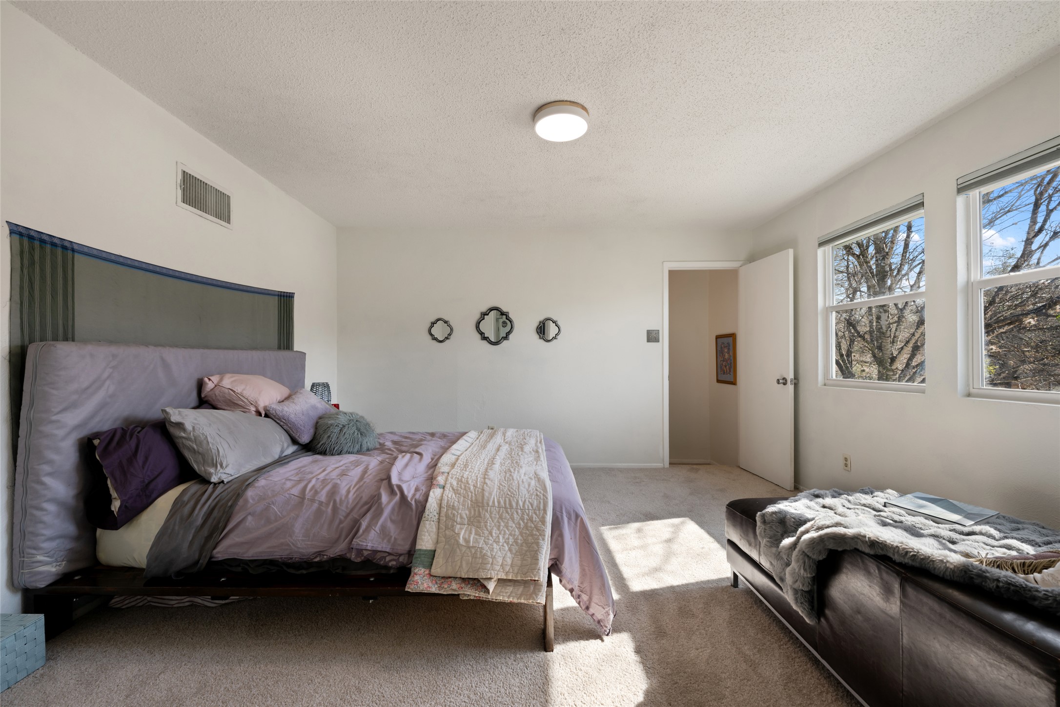 5100 Lambs Lane Austin, TX 78744 - Photo 23 of 31 Upstairs primary bedroom with fresh carpet.