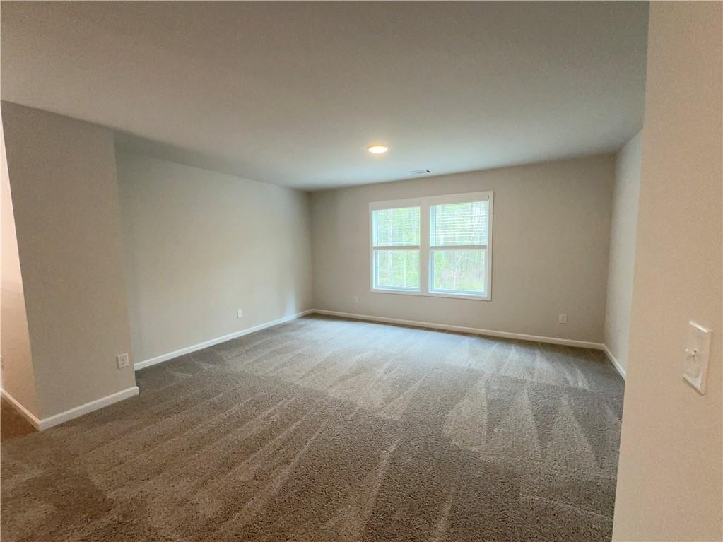 345 Rodeo Drive Auburn, GA 30011 - Photo 14 of 22 an empty room with a window
