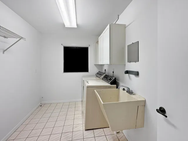 a view of a livingroom with wooden floor and potted plant