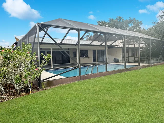 a view of swimming pool with a yard