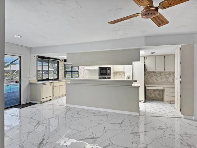 a view of empty room with a fireplace and cabinet