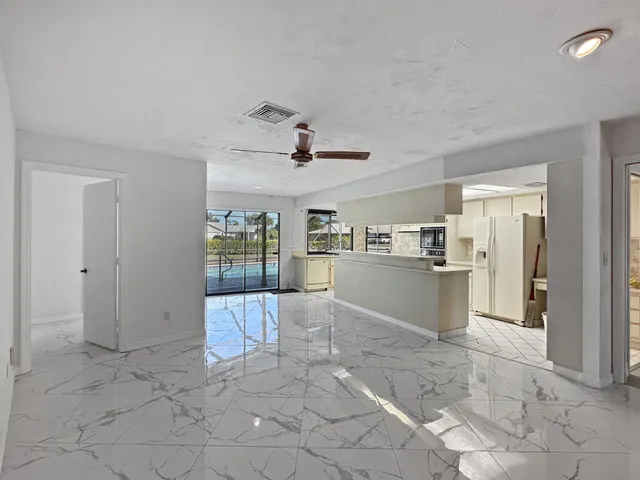 a bathroom with a bathtub sink vanity and mirror