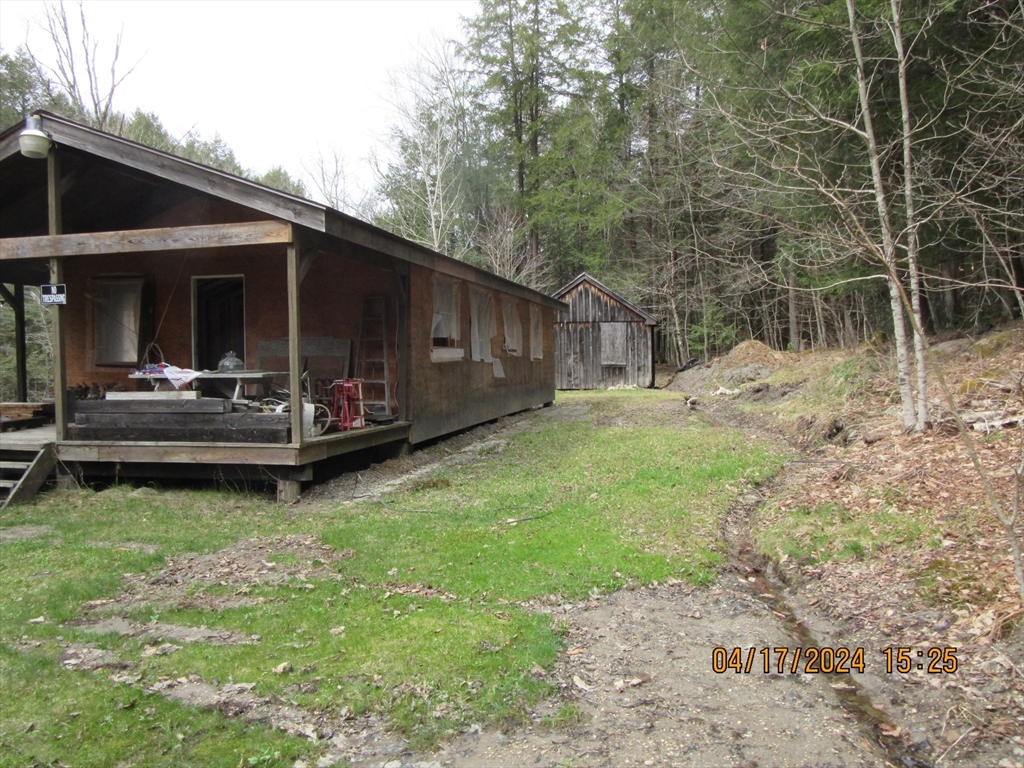 a backyard of a house with barbeque oven stove and open kitchen