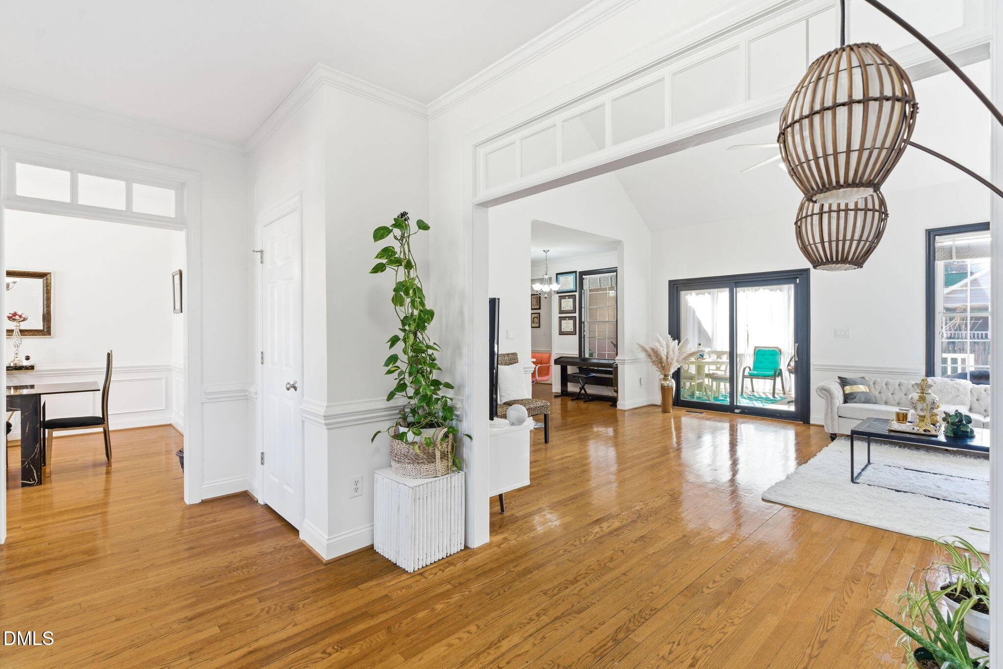 7605 Double E Court Raleigh, NC 27613 - Photo 9 of 49 a view of a livingroom with furniture a potted plant and wooden floor