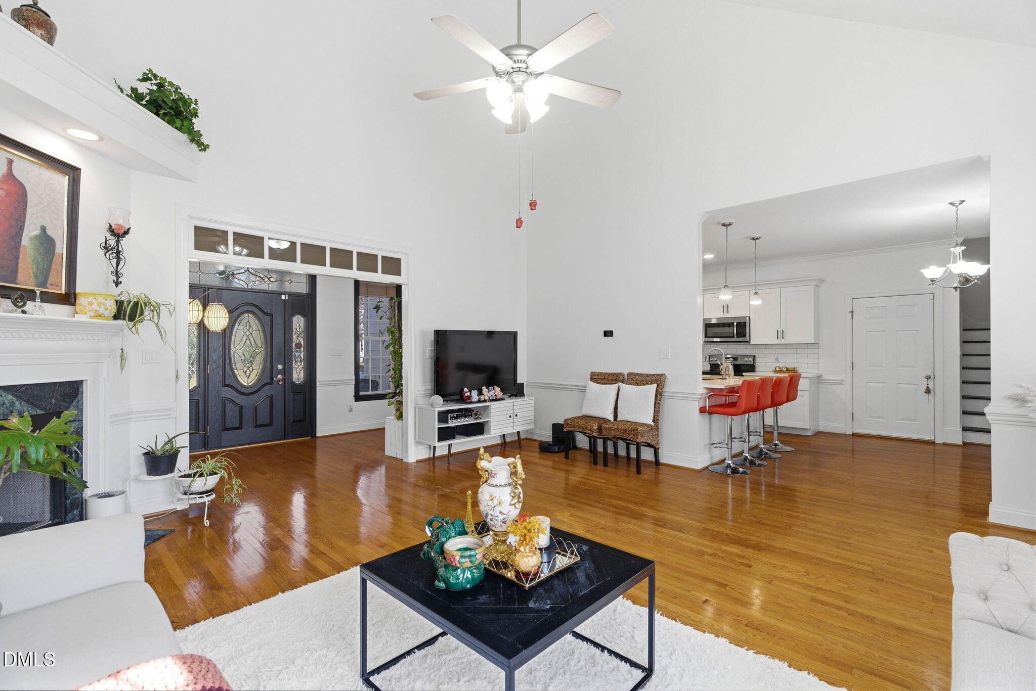 7605 Double E Court Raleigh, NC 27613 - Photo 11 of 49 a living room with furniture and a flat screen tv