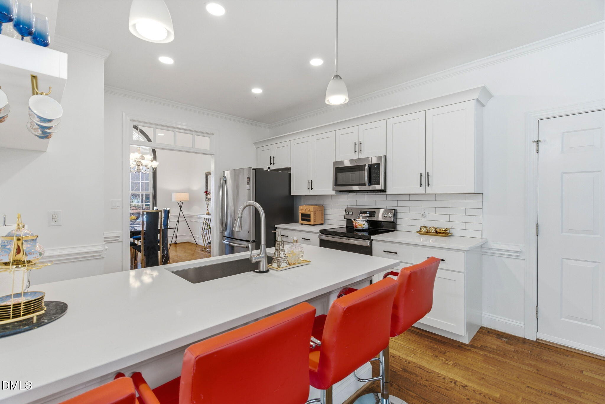 7605 Double E Court Raleigh, NC 27613 - Photo 14 of 49 a kitchen with stainless steel appliances granite countertop a sink refrigerator and microwave