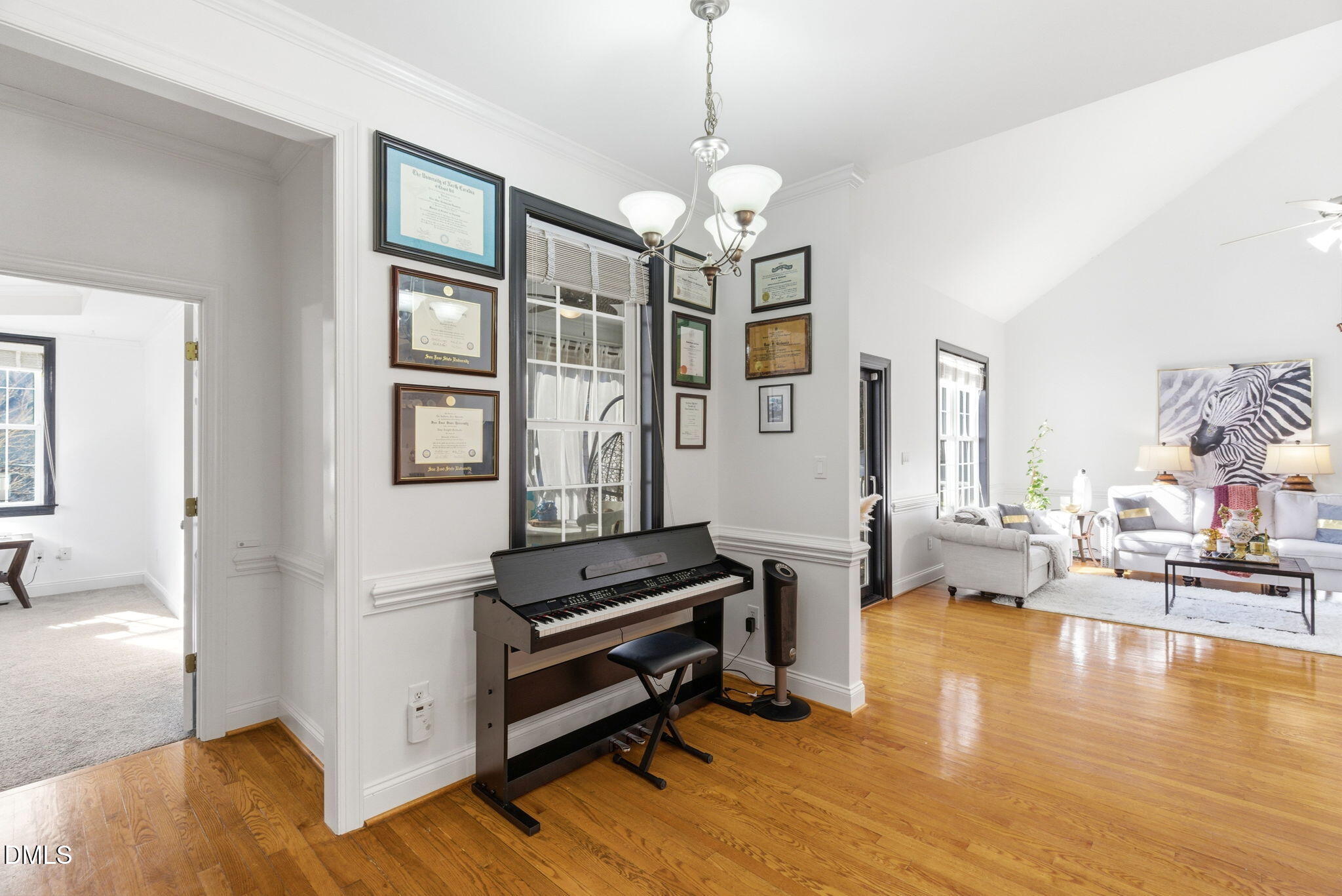 7605 Double E Court Raleigh, NC 27613 - Photo 18 of 49 a living room with furniture and a wooden floor