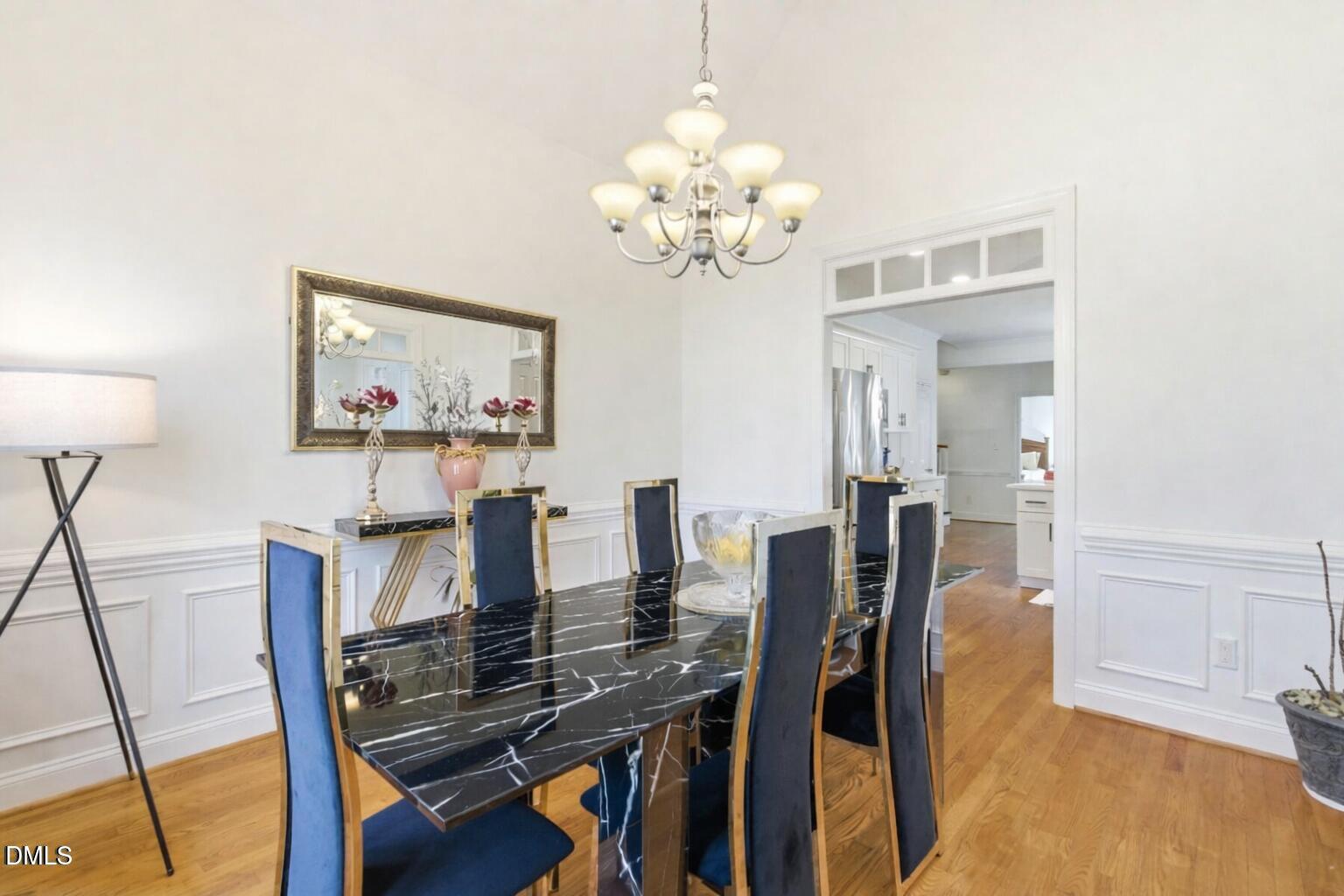 7605 Double E Court Raleigh, NC 27613 - Photo 21 of 49 a view of a dining room with furniture and wooden floor