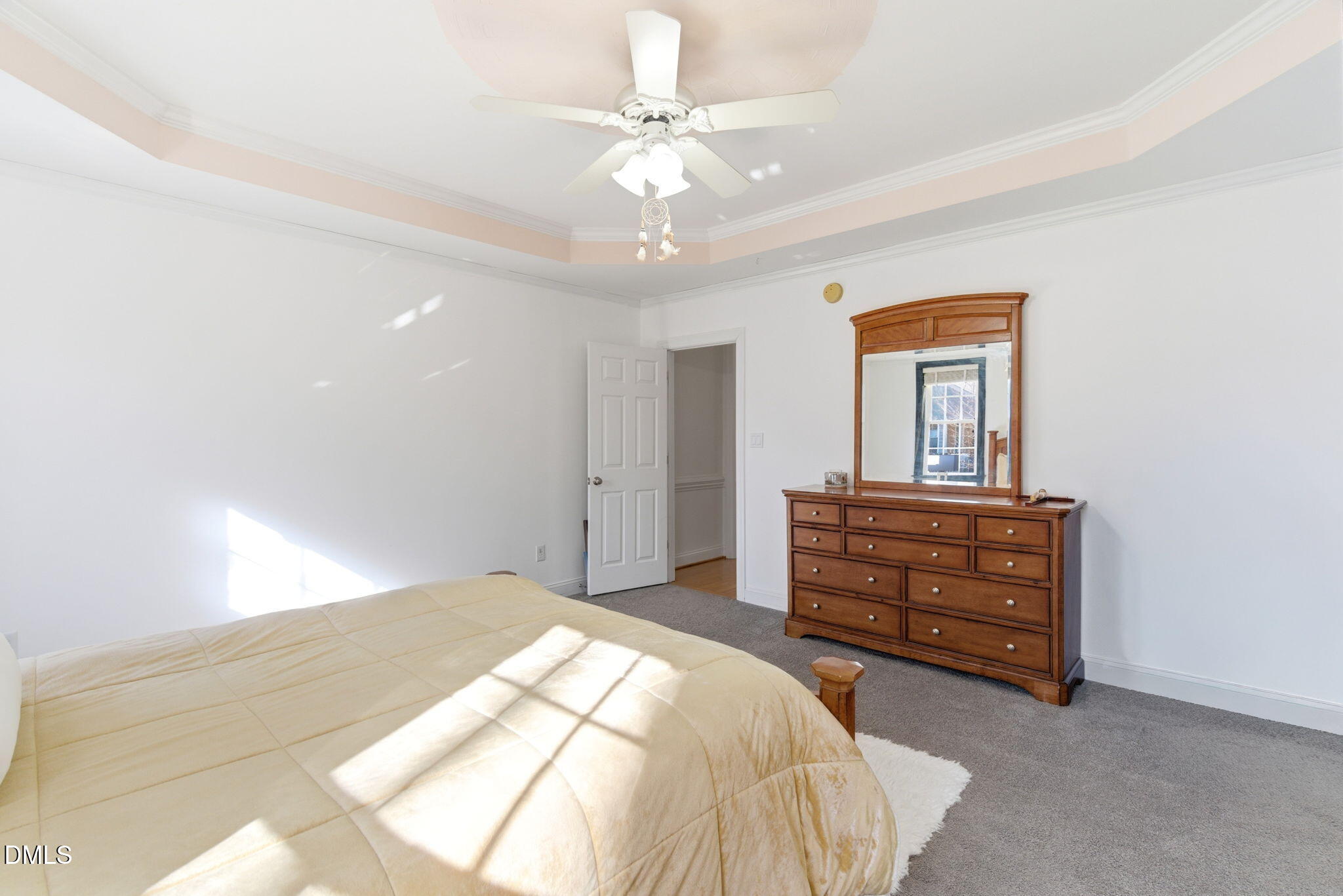 7605 Double E Court Raleigh, NC 27613 - Photo 24 of 49 a bedroom with a bed and a dresser