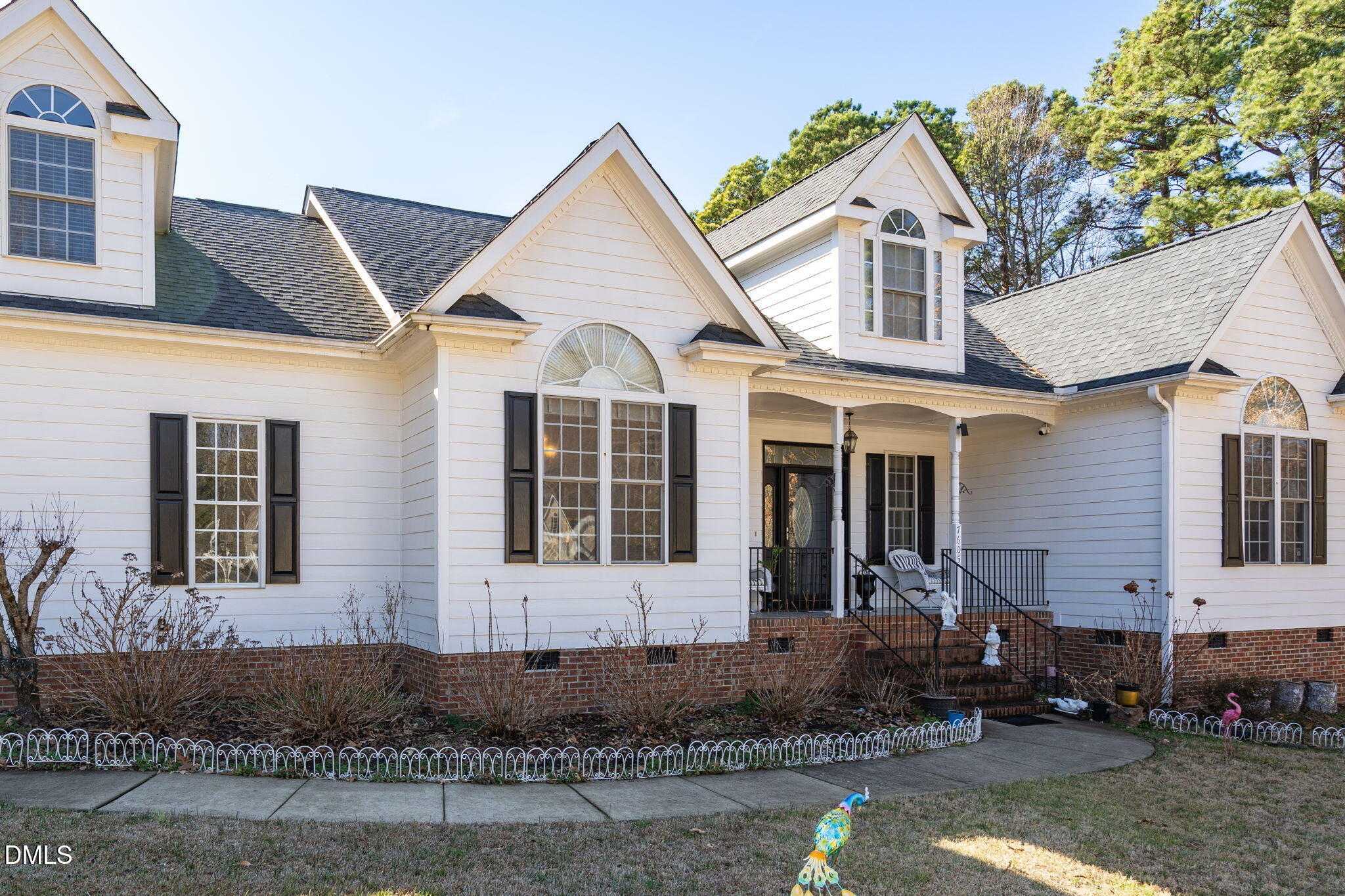 7605 Double E Court Raleigh, NC 27613 - Photo 2 of 49 a front view of a house with a yard