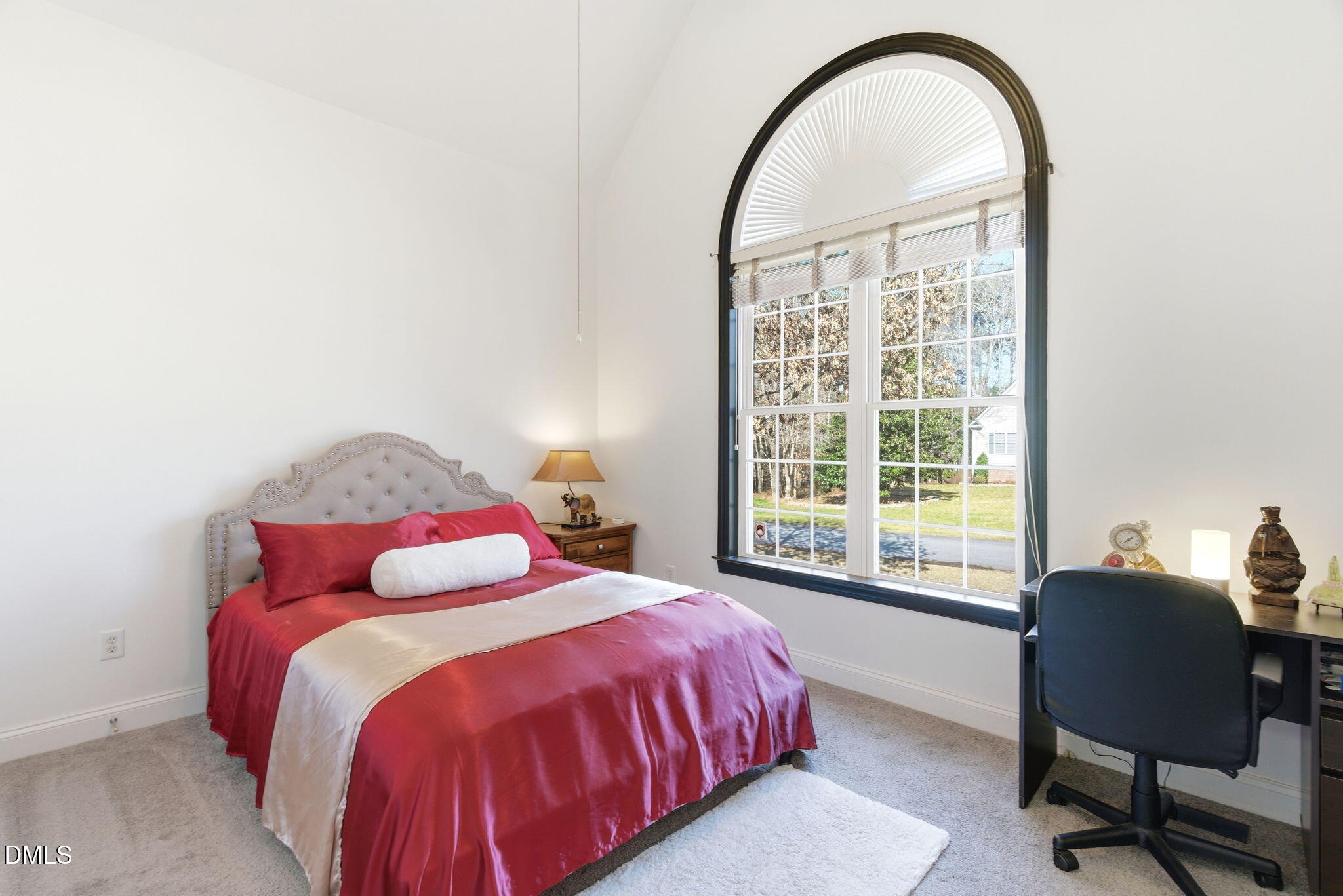 7605 Double E Court Raleigh, NC 27613 - Photo 30 of 49 a bedroom with a bed and a window