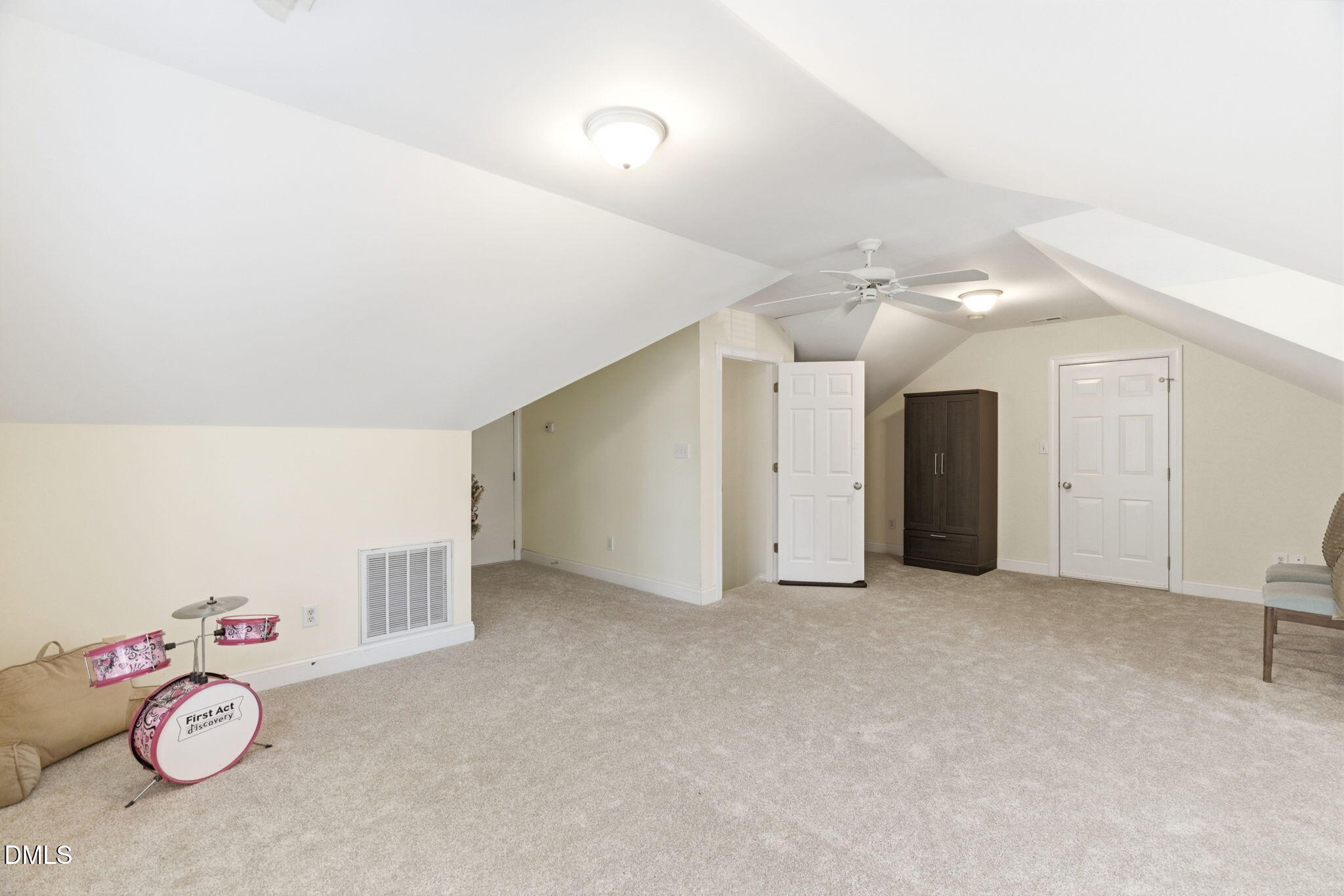 7605 Double E Court Raleigh, NC 27613 - Photo 33 of 49 an empty room with kitchen natural and white doors