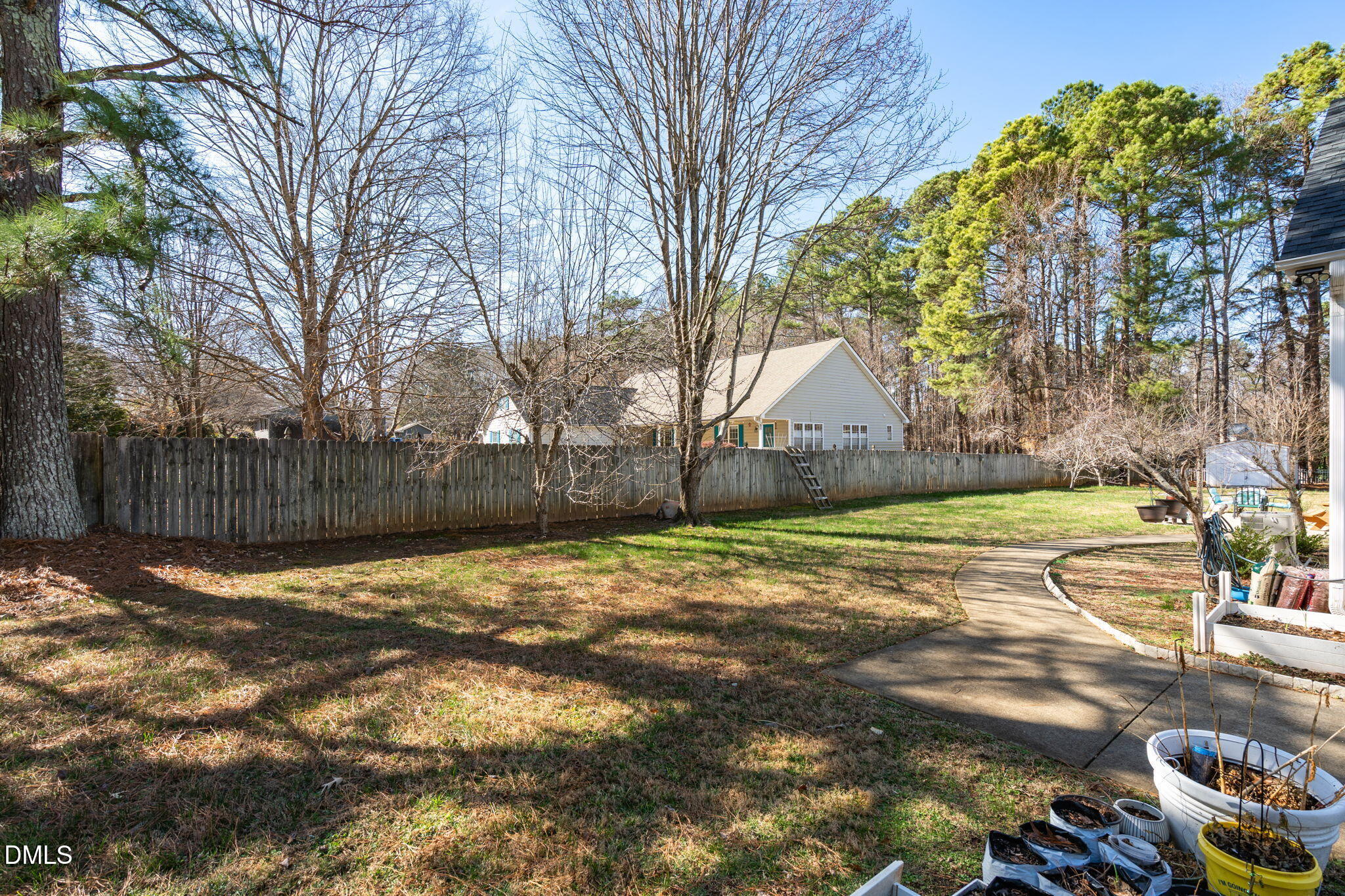 7605 Double E Court Raleigh, NC 27613 - Photo 45 of 49 a view of a house with a yard and covered with snow