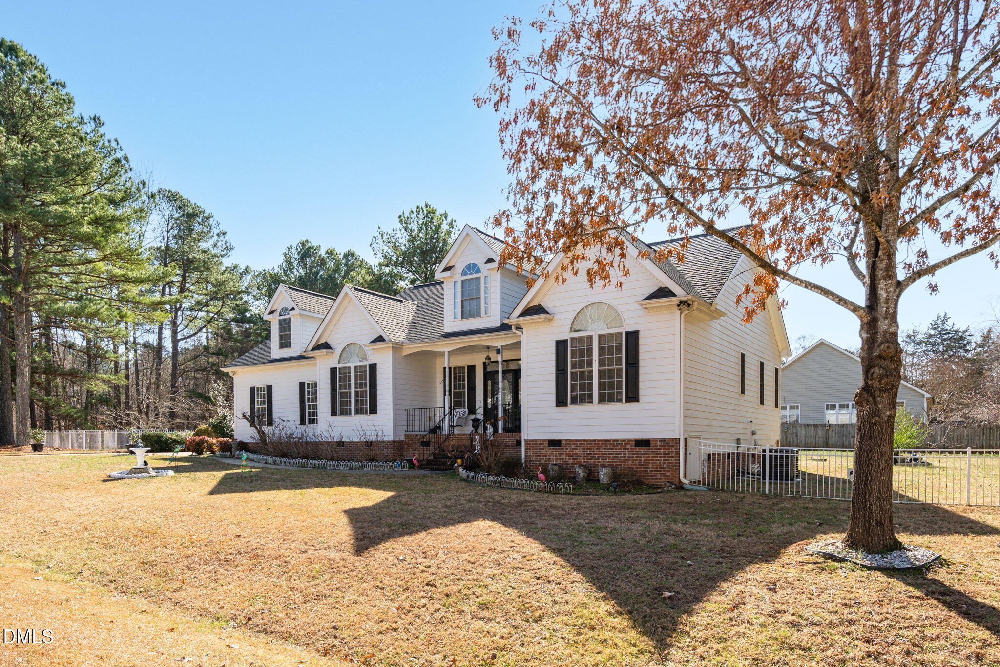 7605 Double E Court Raleigh, NC 27613 - Photo 3 of 49 a front view of a house with a yard covered with snow