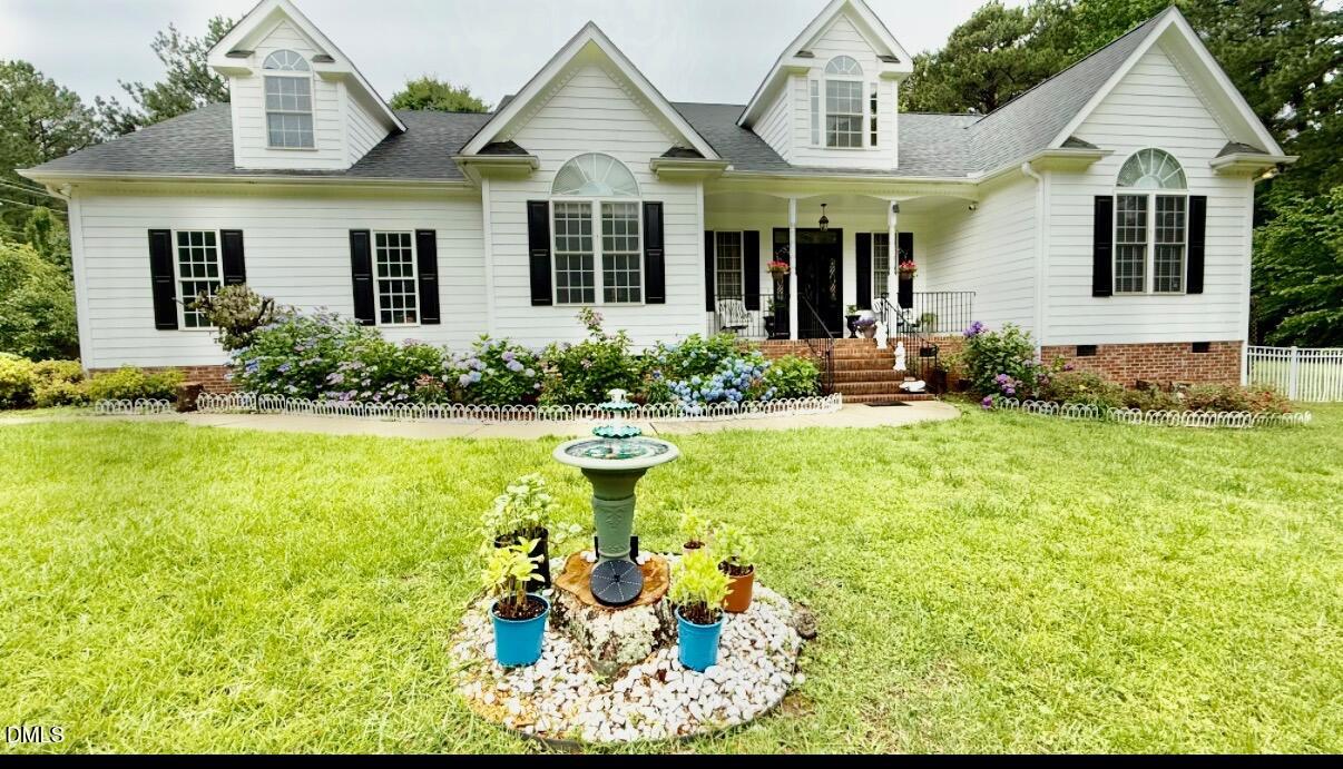 7605 Double E Court Raleigh, NC 27613 - Photo 4 of 49 a front view of a house with swimming pool and porch