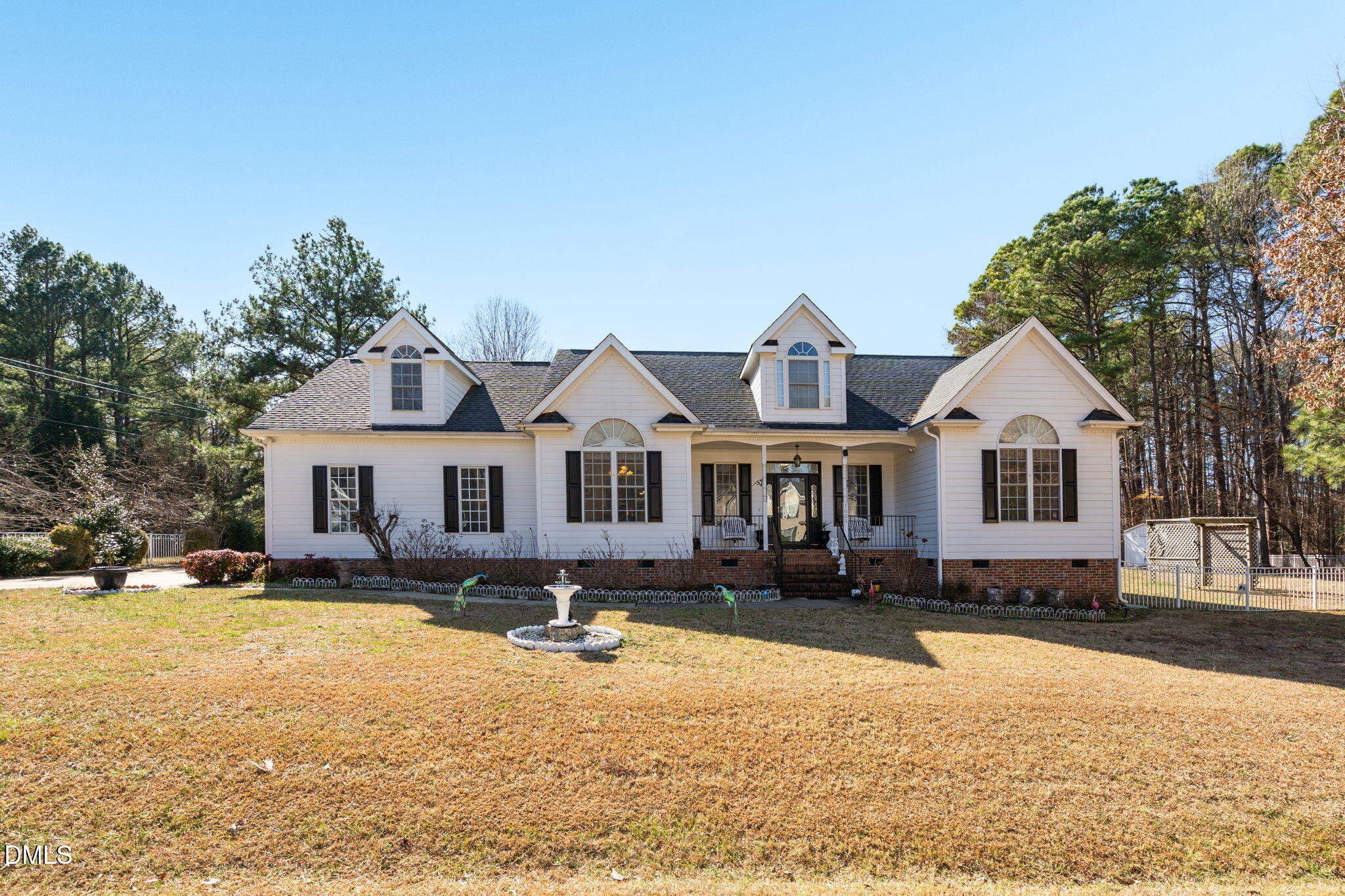 7605 Double E Court Raleigh, NC 27613 - Photo 7 of 49 a front view of a house with a yard covered in snow