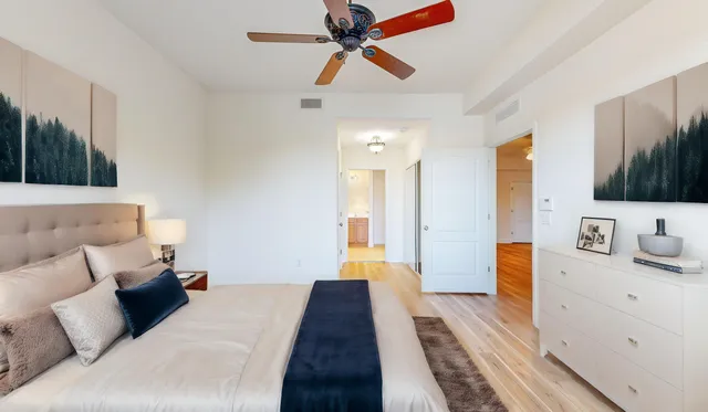 a bed room with a bed window and a television