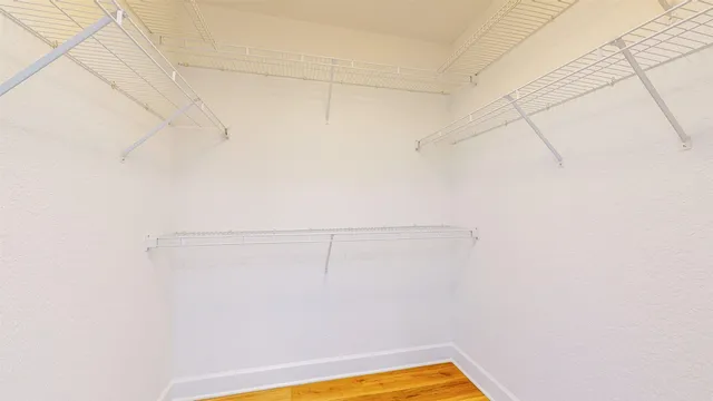 a view of a room with racks on the wall