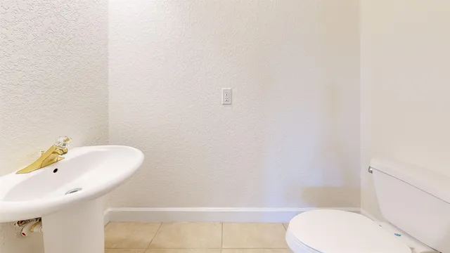 a bathroom with a sink and a toilet