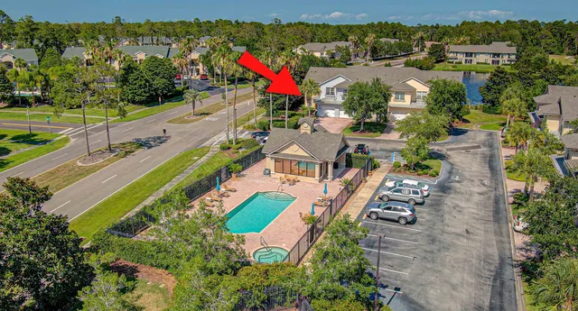 an aerial view of multiple houses with yard