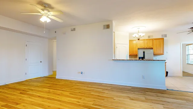 a view of a kitchen with a sink and a cabinet