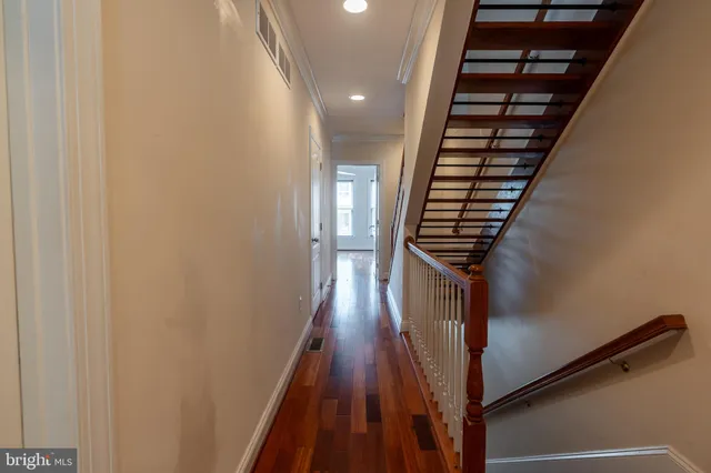 a view of entryway with wooden floor