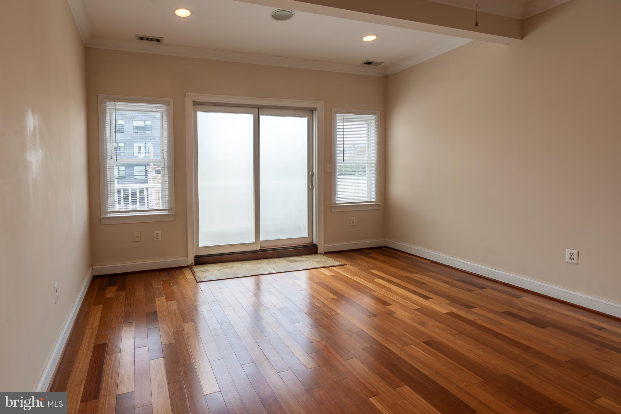 106 West Cross Street Baltimore, MD 21230 - Photo 28 of 41 an empty room with wooden floor and windows