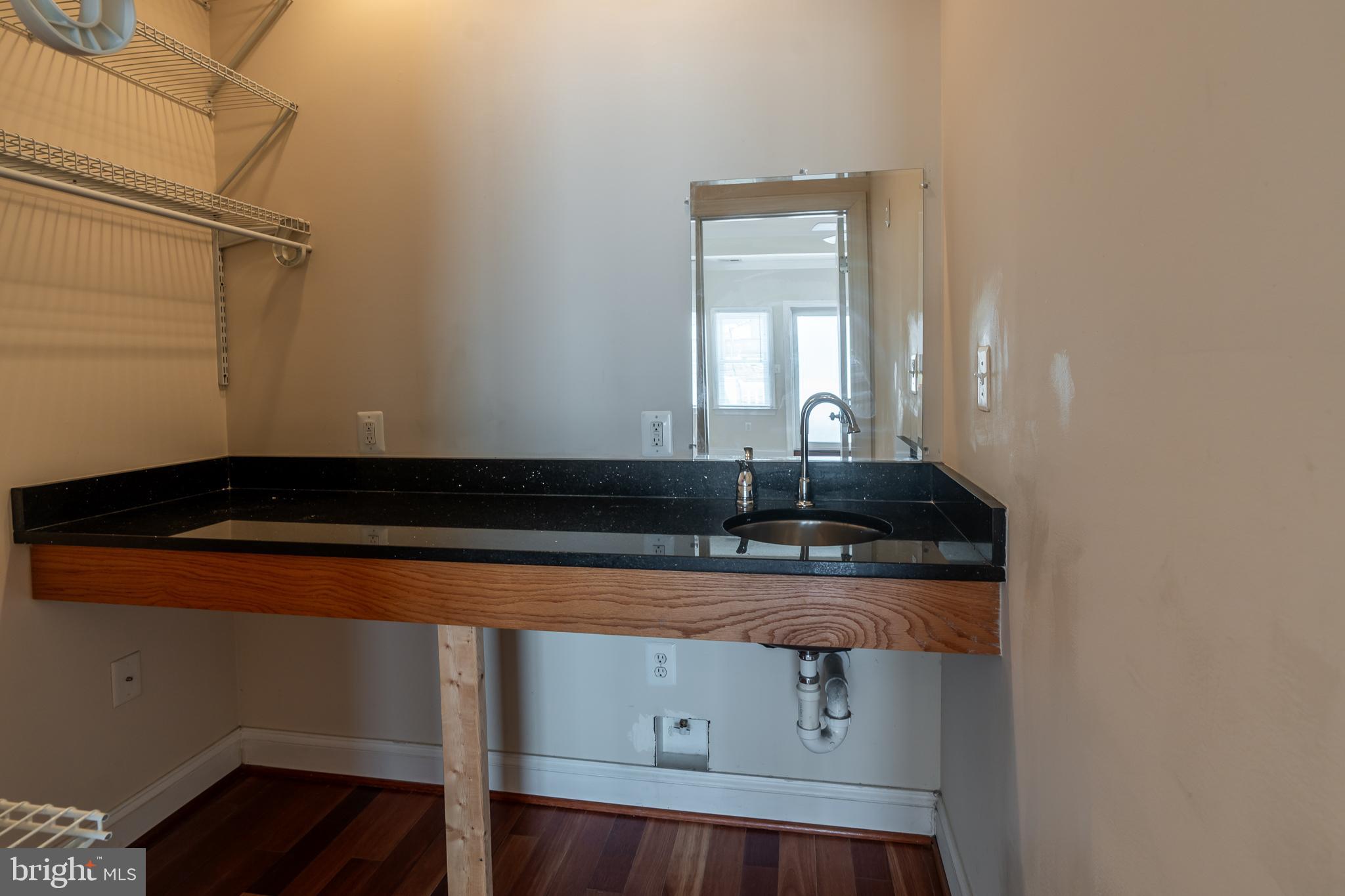 106 West Cross Street Baltimore, MD 21230 - Photo 31 of 41 a bathroom with a sink and a mirror