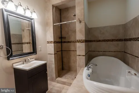a bathroom with a sink and mirror