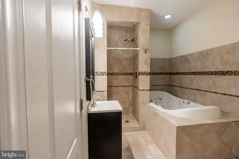 a bathroom with a bathtub and sink